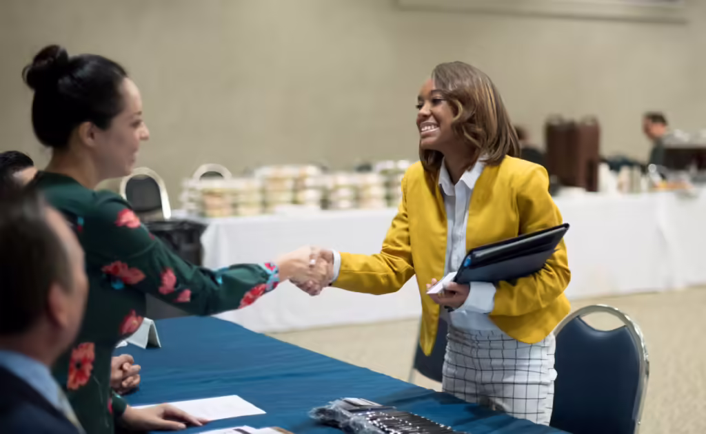 Two women shaking hands