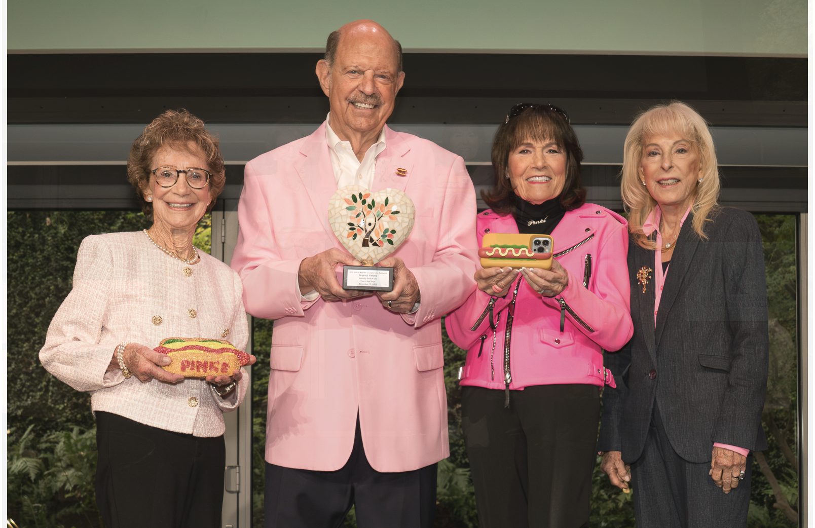 Beverly Pink-Wolfe Richard Pink and Gloria Pink holding awards